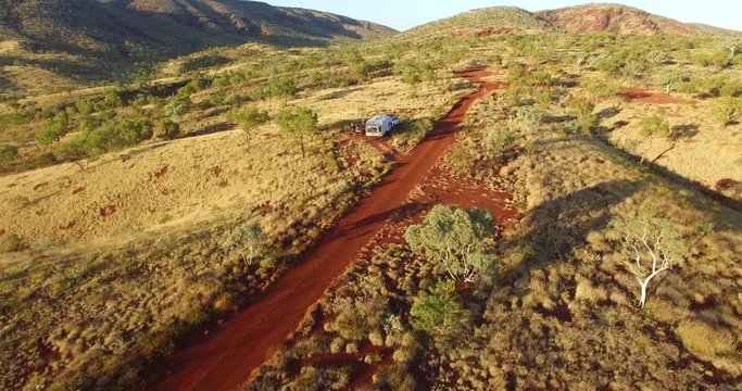 Aerial views of 4WD and large caravan free camping in the wilderness of the the Karijini National Park, Pilbara Region, Western Australia