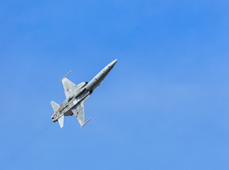 fighter jet military aircraft  flying on blue sky background