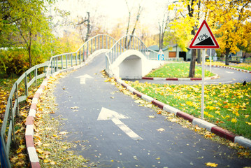 Track with bridge and road signs. Selective focus.