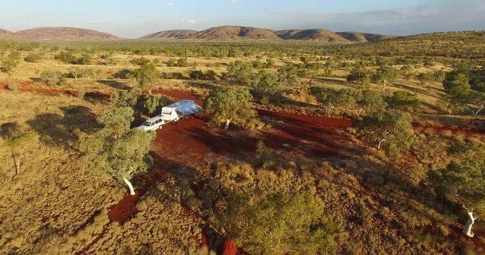 Aerial views of 4WD and large caravan free camping in the wilderness of the the Karijini National Park, Pilbara Region, Western Australia
