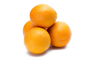 four oranges on white