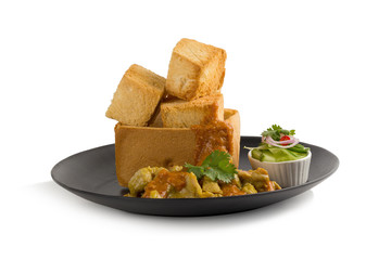 Pork satays with peanut sauce and pickles which are cucumber slices and onions in vinegar served with toast