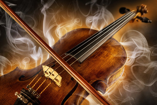 violin and surrounded by smoke