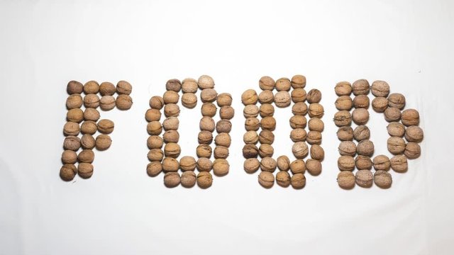 Food word written with letters formed from walnut