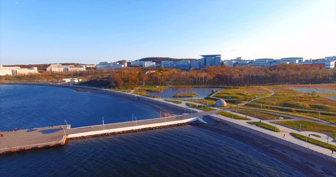 Campus of Far Eastern Federal University front aerial view. Bay, pier and park. Vladivostok, Russia.
