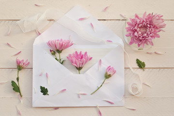 White envelope with pink chrysanthemun