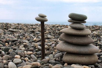 Pinnacles of sea pebbles on the beach.