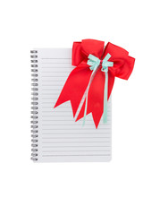 Red ribbons  with tails on note book