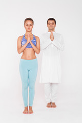 Fototapeta premium A young woman is engaged in yoga with an experienced coach.
