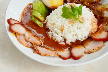 barbecue and crispy pork dressing sweet red gravy sauce on rice