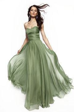 Brunette in a long dress posing