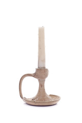 Candle on ceramic holder isolated on white