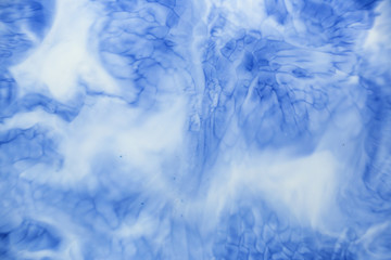 Obraz premium Closeup abstract color mixing of acrylic for use as background. Acrylic texture with marble pattern, blue marbling background 