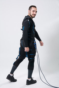 Young fitness man in an electric stimulation