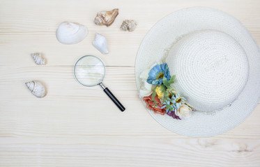 Hat bamboo weave decorated with flowers on wood background