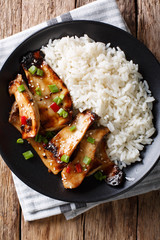 grilled king oyster mushrooms with rice and teriyaki sauce close-up. Vertical top view