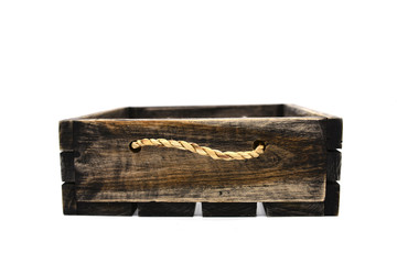 Empty retro dark brown wooden box with rope on white background