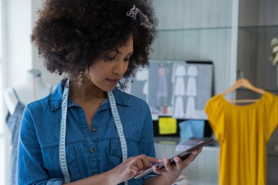 Female Designer Using Digital Tablet