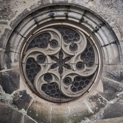 Old gothic cathedral round window.