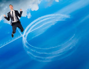 Happy businessman flies in blue sky, leaving behind a trail of white circles