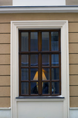 Wooden window, lamp, glass, wine bottle behind