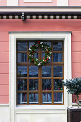 Fototapeta na wymiar Wooden window with Christmas wreath