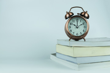 alarm clock and book