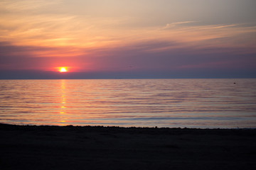 Sea Sunrise with clouds and waves