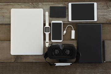 Various electronic gadgets on wooden surface