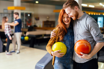 Beautiful couple dating and bowling