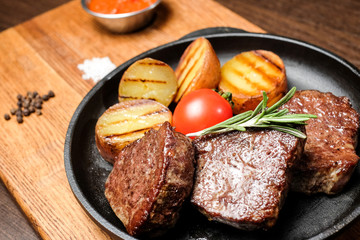 meat frying pan potatoes vegetables dish