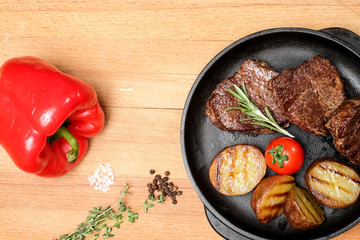 meat frying pan potatoes vegetables dish