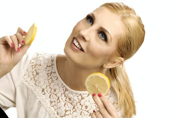 Beautiful woman holding a lemon