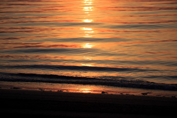 Fototapeta na wymiar Sea Sunrise with clouds and waves