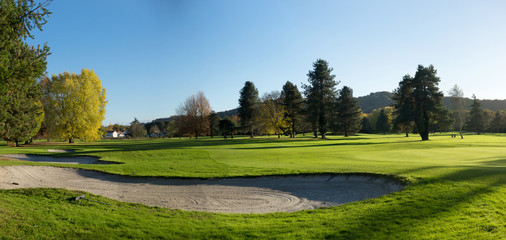 bunker on the golf course with trees