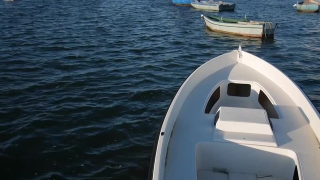footage at the sunset of the stagnone park near trapani and marsala in sicily in backlight with moored boats