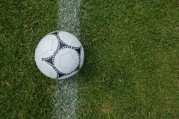Fototapeta na wymiar Soccer ball on white marking line