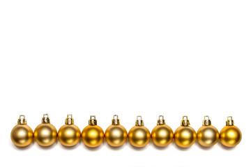 Row of gold New Year and Christmas balls isolated