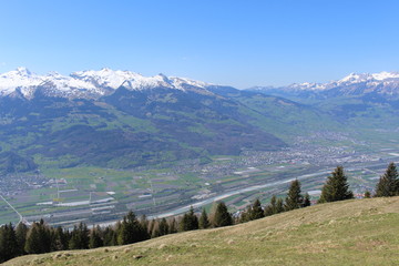 Fototapeta na wymiar Aerial view of Liechtenstein (Upper Rhine valley), taken from the Alpspitz peak in Gaflei village in the municipality of Triesenberg.