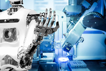 Artificial Intelligence on industrial robotics in blue tone color background, The robot has a role...