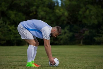 Football player ready to kick the soccer ball