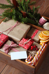 Wooden box with a set of Christmas gifts