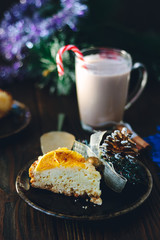 Shot of christmas pie - delicious cake over the dark table.