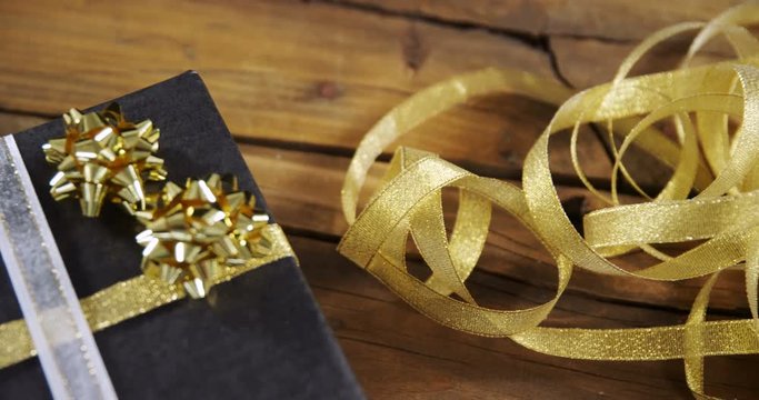 Christmas gift box and decoration on wooden table 
