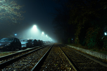 tram tracks in a foggy night