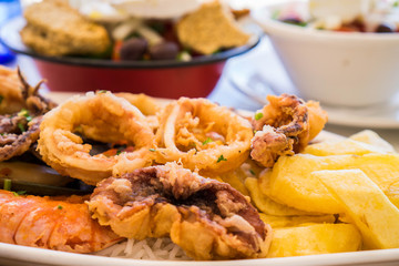 Fried Sea food and greek salad in Crete, Greece