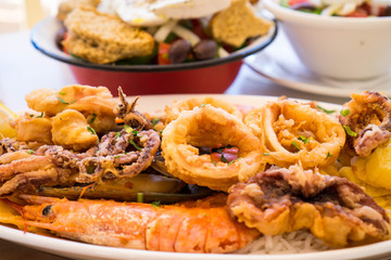 Fried Sea food and greek salad in Crete, Greece