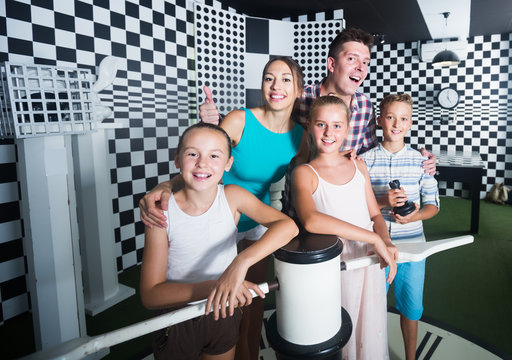 Smiling family is visiting of escaperoom