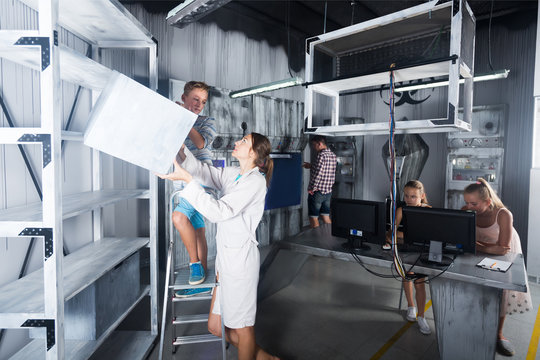 Parents with kids visiting room stylized under laboratory