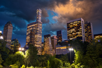 Central Park and skyscrapers at dusk in New York